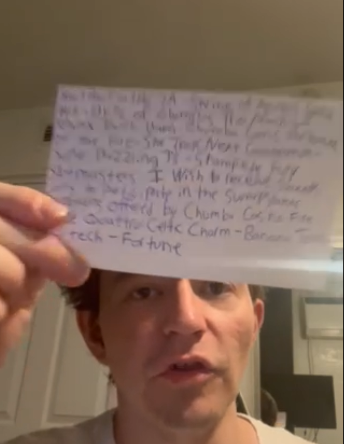 Inside the course: a handwritten index card with the AMOE letter writing example, held in hand